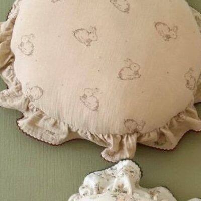 decorative cushion for baby nurserys with rabbit design and neutral tones